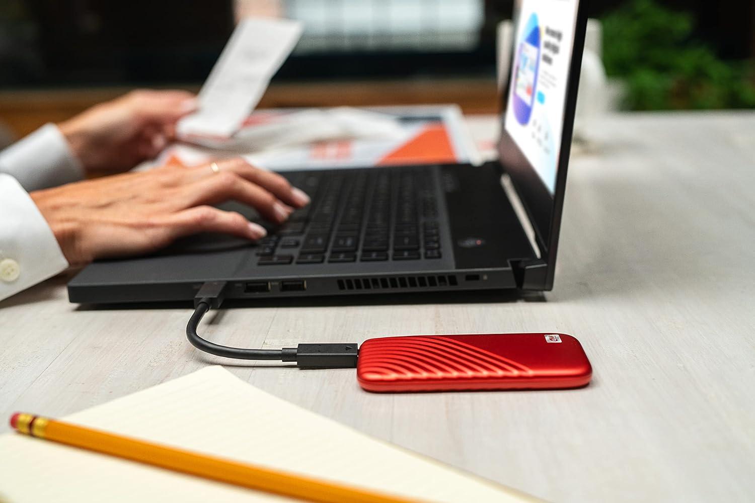 imageWestern Digital 2TB My Passport SSD Portable External Solid State Drive Red Sturdy and Blazing Fast Password Protection with Hardware Encryption  WDBAGF0020BRDWESNRed
